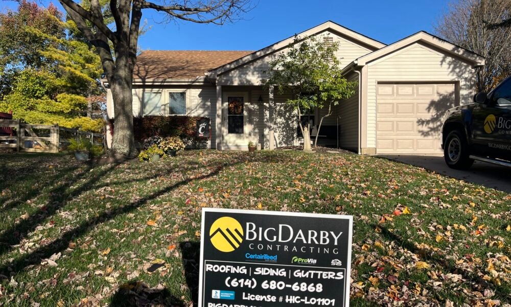 IMG_7659 early morning with a large roof workers removing the shingles