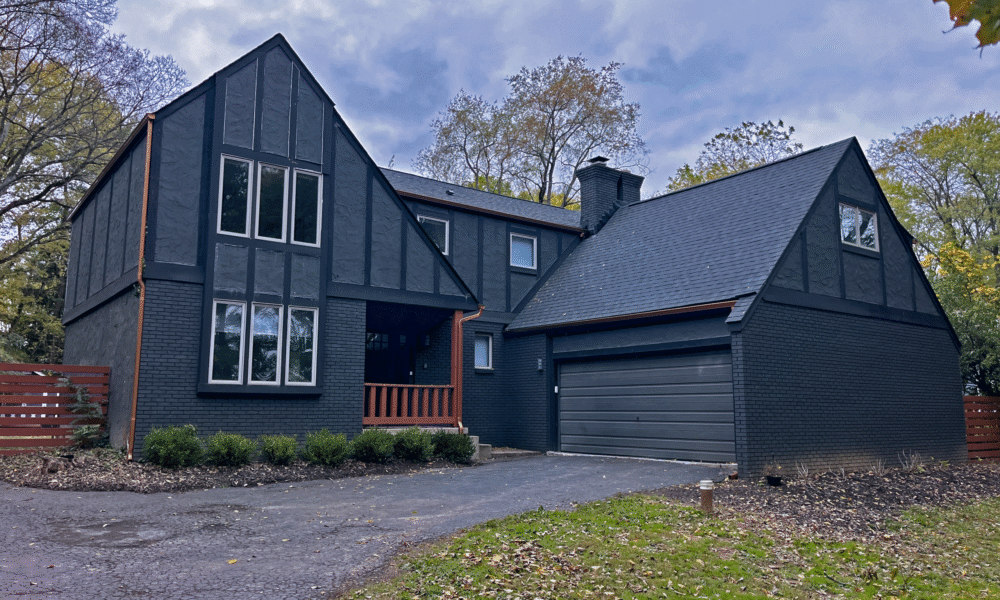 roof replacement west jefferson ohio trucks in front of a large home with the roof getting replaced west jefferson ohio roof replacement